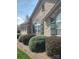 Charming stone home with green shutters, manicured bushes, and arched windows at 811 Wynnshire Dr # A, Hickory, NC 28601