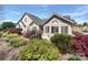 Beautiful home with stone and siding, arched windows, and lush, vibrant landscaping at 811 Wynnshire Dr # A, Hickory, NC 28601