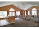 A clubhouse interior featuring tables, chairs, windows with curtains and a kitchenette at 811 Wynnshire Dr # A, Hickory, NC 28601
