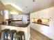 Spacious kitchen featuring white cabinetry, granite countertops, and a functional breakfast bar at 811 Wynnshire Dr # A, Hickory, NC 28601