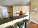 Bright kitchen features white cabinets, granite countertops, and bar seating at 811 Wynnshire Dr # A, Hickory, NC 28601