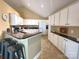 Well-equipped kitchen with granite countertops, white cabinets and breakfast bar seating at 811 Wynnshire Dr # A, Hickory, NC 28601