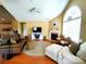 Open-concept living room with vaulted ceiling, fireplace, and hardwood floors at 811 Wynnshire Dr # A, Hickory, NC 28601