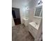 Bright bathroom featuring double vanities, with neutral tiling at 818 N 4Th St, Albemarle, NC 28001