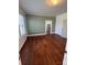 Inviting bedroom with beautiful hardwood flooring, complemented by neutral-toned walls and classic trim at 818 N 4Th St, Albemarle, NC 28001