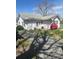 Charming home with a blooming azalea bush with mature tree and partial gravel driveway at 818 N 4Th St, Albemarle, NC 28001