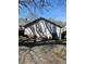 Detached garage with weathered paint, offering a glimpse of a red truck and storage opportunities at 818 N 4Th St, Albemarle, NC 28001