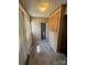 Hallway with neutral tones, and access to adjacent rooms, including a bathroom at 818 N 4Th St, Albemarle, NC 28001