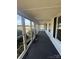 Enclosed porch lined with multiple windows overlooking the surrounding area at 818 N 4Th St, Albemarle, NC 28001