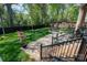 Manicured backyard featuring a stone patio and seating area at 8209 Bella Vista Ct, Charlotte, NC 28216