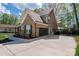 Spacious driveway leading to a brick home with a basketball hoop, offering ample parking and outdoor activities at 8209 Bella Vista Ct, Charlotte, NC 28216