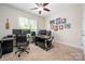Home office featuring two workstations and natural light at 8209 Bella Vista Ct, Charlotte, NC 28216