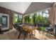 Covered outdoor patio with ample seating and view of the lush yard, perfect for outdoor entertaining at 8209 Bella Vista Ct, Charlotte, NC 28216
