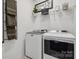 Well-equipped laundry room featuring modern washer and dryer appliances and storage at 825 Hallman Branch Ln, Lincolnton, NC 28092