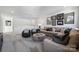Large living room featuring comfortable sectional seating, a round ottoman and modern decor at 825 Hallman Branch Ln, Lincolnton, NC 28092