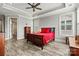 Cozy bedroom with wood floors, a ceiling fan, and natural light streaming through the windows at 8718 Festival Way, Charlotte, NC 28215