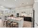 Modern kitchen with stainless steel appliances, granite counters, and large island at 8718 Festival Way, Charlotte, NC 28215