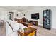 Open-concept living room boasts wood floors, large tv, and modern furniture at 8718 Festival Way, Charlotte, NC 28215