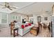 Bright and open living room with modern furniture, hardwood floors and ceiling fan at 8718 Festival Way, Charlotte, NC 28215