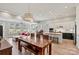 Open-concept living space with a dining area, kitchen, and living room at 8718 Festival Way, Charlotte, NC 28215