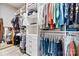 Spacious walk-in closet with custom shelving and hanging racks for optimal storage at 8718 Festival Way, Charlotte, NC 28215