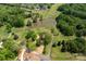 Lush aerial view of expansive lot, highlighting the pond and surrounding greenery at 8805 Wingard Dr, Waxhaw, NC 28173