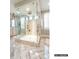 Modern bathroom featuring a glass-enclosed shower and elegant tile flooring at 8805 Wingard Dr, Waxhaw, NC 28173