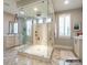 Bathroom featuring a glass enclosed shower with dual showerheads and marble flooring at 8805 Wingard Dr, Waxhaw, NC 28173