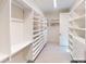 Walk-in closet with built-in shelving and ample storage space at 8805 Wingard Dr, Waxhaw, NC 28173