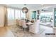Bright dining room features shuttered windows, area rug, and opens to an outdoor living space at 8805 Wingard Dr, Waxhaw, NC 28173