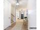 Inviting entryway with wood floors, stylish lighting, and shiplap accent wall at 8805 Wingard Dr, Waxhaw, NC 28173
