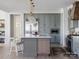 Well-appointed kitchen with stainless steel appliances, custom cabinetry, and a large center island at 8805 Wingard Dr, Waxhaw, NC 28173