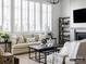 Cozy living room featuring a fireplace, built-in shelving, and neutral decor at 8805 Wingard Dr, Waxhaw, NC 28173
