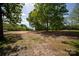 View of lot showing a level clearing and the foundation from a previous structure at 8805 Wingard Dr, Waxhaw, NC 28173
