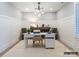 Bright, spacious home office with wainscotting, white desk and neutral decor at 8805 Wingard Dr, Waxhaw, NC 28173