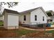 Back exterior view showing the yard, storage unit, and a partial view of the house and fenced in area at 904 Brook St, Belmont, NC 28012