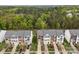 Aerial view of well-maintained townhomes with manicured lawns and convenient parking spaces at 10308 Garrett Grigg Rd, Charlotte, NC 28262