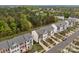 Aerial shot of townhomes showcasing green spaces, tree coverage, and community layout at 10308 Garrett Grigg Rd, Charlotte, NC 28262