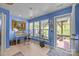 Bright bedroom with a desk, backyard views, and access to the outdoors at 10308 Garrett Grigg Rd, Charlotte, NC 28262