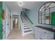 Charming foyer features light blue walls, a statement mirror, and wood floors at 10308 Garrett Grigg Rd, Charlotte, NC 28262