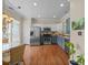 Open kitchen featuring stainless steel appliances, hardwood floors, and natural lighting at 10308 Garrett Grigg Rd, Charlotte, NC 28262