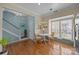 Bright living room with hardwood floors, natural light, and adjacent dining area at 10308 Garrett Grigg Rd, Charlotte, NC 28262