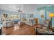 Spacious living room with hardwood floors, bright natural light, and neutral decor at 10308 Garrett Grigg Rd, Charlotte, NC 28262