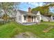 Charming home with a classic design, cozy front porch and well-manicured lawn at 106 Courtland St, Chester, SC 29706