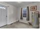 Utility room with water heater, white door and a window at 106 Courtland St, Chester, SC 29706