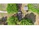 Aerial view of a home with a large yard, mature trees, detached garage, and a trampoline at 1099 S Potter Rd, Lancaster, SC 29720
