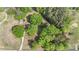 Aerial shot showcasing a home nestled among mature trees at 1099 S Potter Rd, Lancaster, SC 29720
