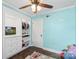 room painted a light blue featuring built-in storage, airplane themed decor, ceiling fan, and a toddler bed at 1099 S Potter Rd, Lancaster, SC 29720