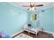 room painted a light blue with airplane themed decorations, ceiling fan, and a toddler bed at 1099 S Potter Rd, Lancaster, SC 29720