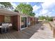 View of a deck with space for grilling beside sliding doors to the brick home at 1099 S Potter Rd, Lancaster, SC 29720